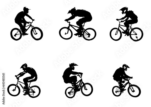 Fototapeta Naklejka Na Ścianę i Meble -  Silhouette of boys riding a bmx bicycle