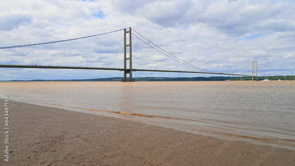 Aerial shot: Humber Bridge, river, traffic, Lincolnshire to Humberside. 12th largest suspension span globally. Aerial shot: Humber Bridge, river, traffic, Lincolnshire to Humberside. 12th largest suspension span globally.