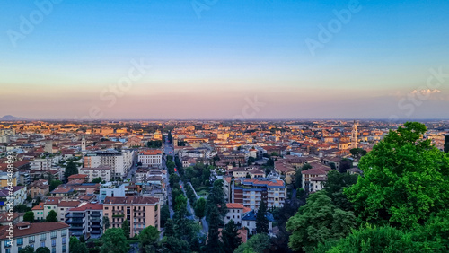 Aerial view of historic medieval walled city of Bergamo seen from Città Alta (Upper Town), Lombardy, Northern Italy, Europe. Landscape at the city center, Its historical buildings and the towers