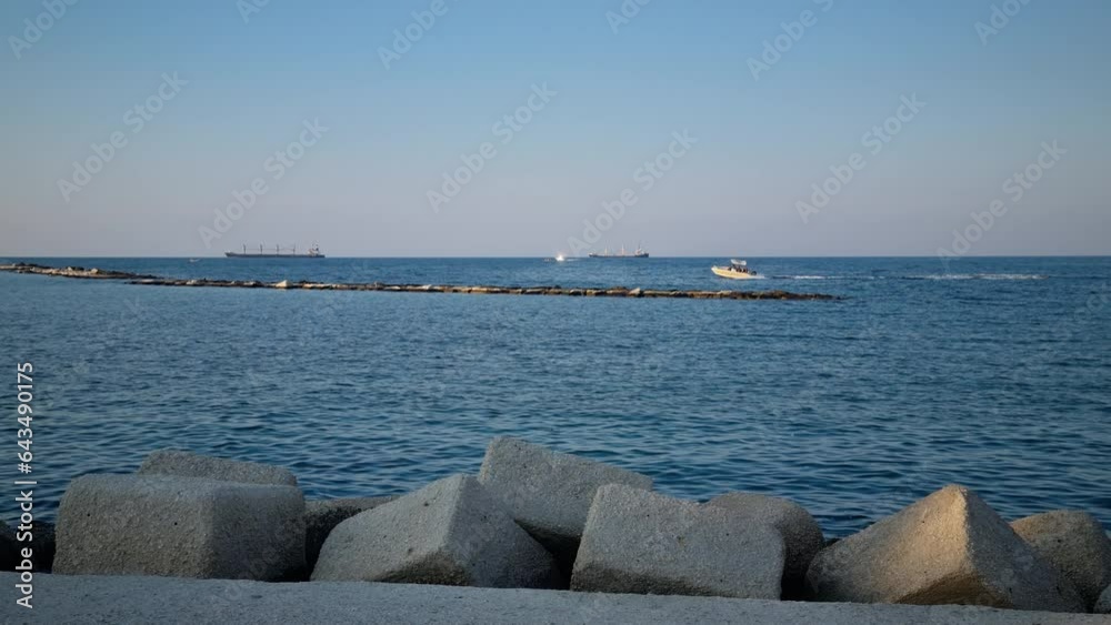 Boat sailing near the coastline of Bari Puglia Italy Boat sailing near the coastline of Bari Puglia Italy