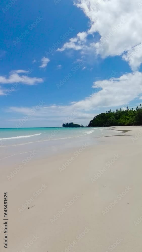 Wide sandy beach with sea waves. Borneo, Malaysia. Kalampunian Beach. Wide sandy beach with sea waves. Borneo, Malaysia. Kalampunian Beach.