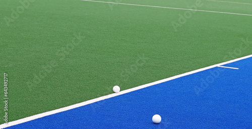 Fotografía Hockey balls on an artificial grass field