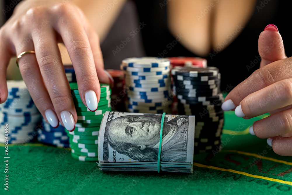 female player counts chips for money and raises bet while playing poker in casino. female player counts chips for money and raises bet while playing poker in casino.