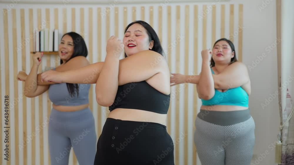 Active plus size woman friends in sportswear having exercising together at home. Happy chubby woman friends doing exercising together. Body acceptance, Body positive concept 
