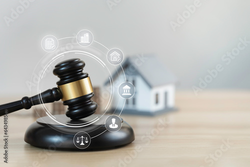 Judge auction and real estate law system concept. House model and gavel with icons on wooden table. Legal of foreclosure and bankruptcy, debts or obligations.