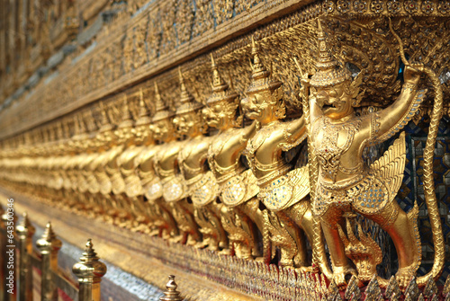 Garuda statue Inside the Grand Palace, Wat Phra Kaew, Thailand, beautiful artwork gold lined up in a long row