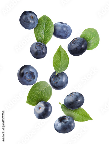 Many ripe blueberries and green leaves falling on white background