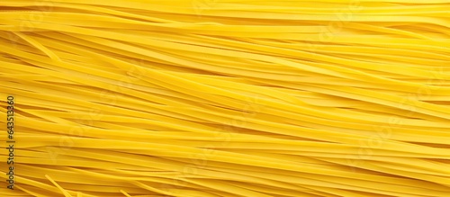 Close up of yellow spaghetti pasta with an Italian pattern on a background