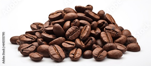 Freshly roasted coffee beans grouped together and separated on a white backdrop