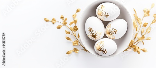 White eggs adorned with gol...