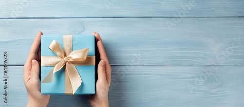 Kid s blue gift box on tabl...