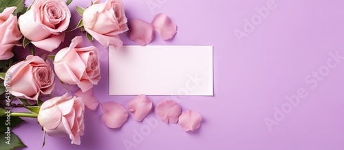 Mockup of a romantic scene with flowers and a blank card on a purple background Suitable for Valentines Spring or Mothers day