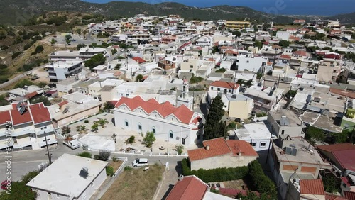 Aerial orbit around white Greece orthodox church in city Embonas, Rhodes photo