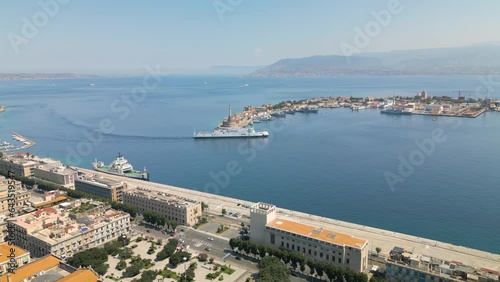 Boat Arrives in Port of Messina - Beautiful Aerial View. Sicilian City in Italy photo