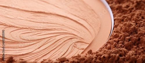 Close up texture of compact face powder bronzer brusher with a circle copy space on a makeup background Selective focus photo