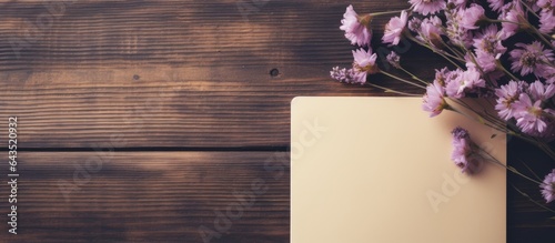Floral and notepaper on woo...