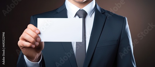 Businessman holding empty c...