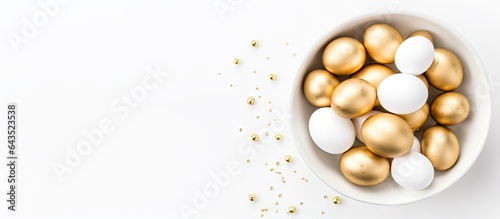 White eggs adorned with gol...