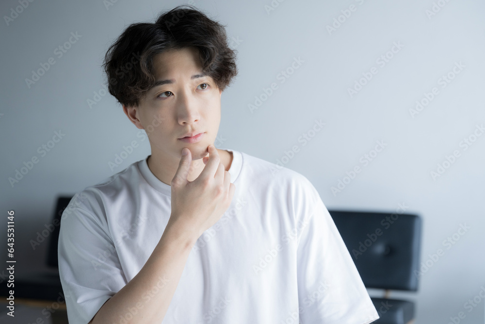 Handsome young Asian man thinking, beard and beauty. Handsome young Asian man thinking, beard and beauty.