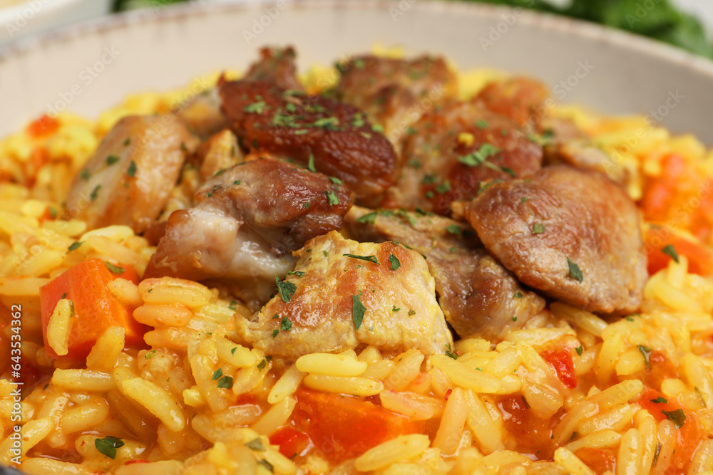 Delicious pilaf with meat in white bowl, closeup Delicious pilaf with meat in white bowl, closeup