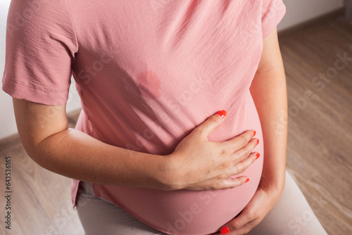 Wallpaper Mural A soaked blouse from milk on the female breast of a nursing mother. Leak-proof bra pads, close-up Torontodigital.ca
