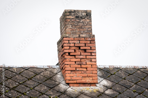 Fotografie Old brick chimney, heating season. Repair and renovation
