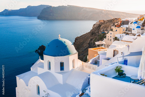 Obraz na płótnie White architecture in Santorini island, Greece. Church with blue dome n Oia town. w salonie