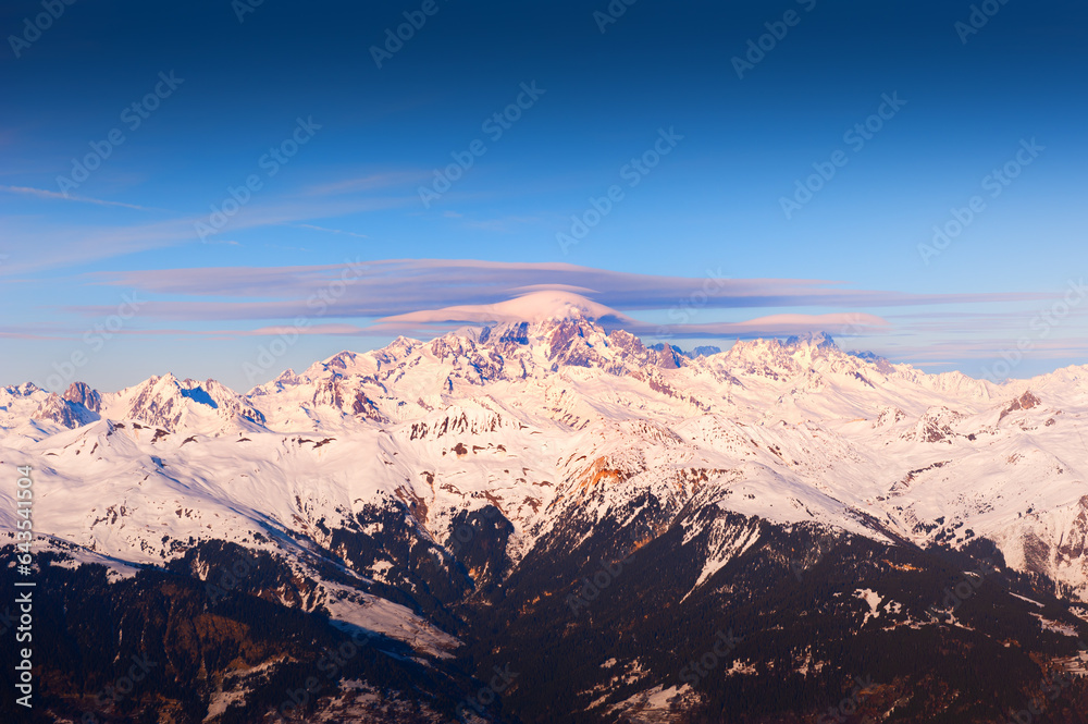 Mont Blanc mount with clouds at sunset. View from Meribel village, France. Winter Alps mountains