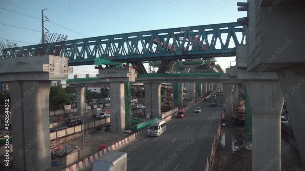 Bridge Girder Erection Machine for Highway construction above busy street. Bridge Girder Erection Machine for Highway construction above busy street.
