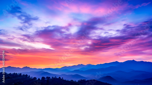 Abstract background of colorful twilight sky, distant mountain.