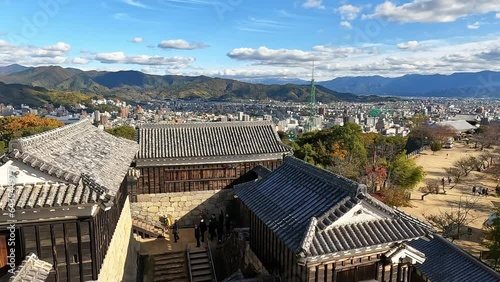 View from the castle towers ont the yard an roofs of Matsuyama Castle, Shikoku, Ehime, Japan. Beautiful blue sky photo