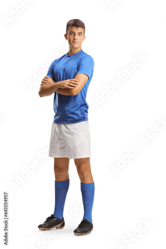 Bild auf Leinwand Full length portrait of a young football player in a blue jersey posing with fol