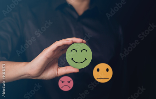 Happy Client giving Positive Review. 
Customer Experience Concept the best feedback for ranking Products and Services. Client Satisfaction choose smiley icon on marketing Strategy. 