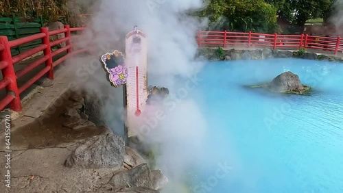 umi jigoku or sea hell taken in beppu with steamy hot springs geyser steaming off the cobalt water. steaming geyser. Taken in Beppu, Japan