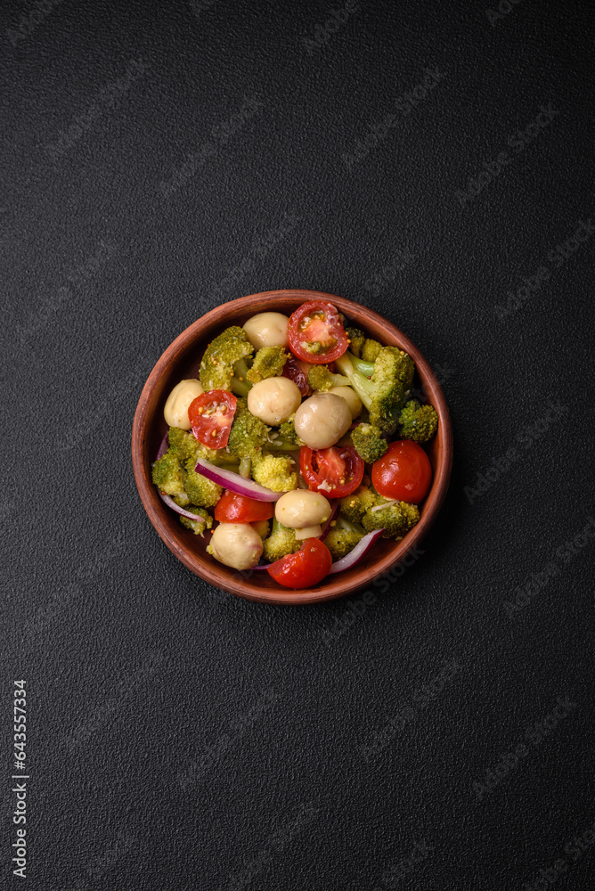 Delicious fresh salad with broccoli, cherry tomatoes, mushrooms, onions, salt, spices and herbs Delicious fresh salad with broccoli, cherry tomatoes, mushrooms, onions, salt, spices and herbs