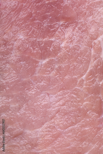 A piece of fresh juicy raw pork with salt, spices and herbs
