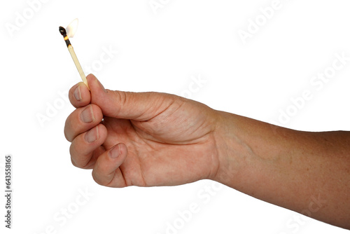 Hand holding burning match. Match burning.