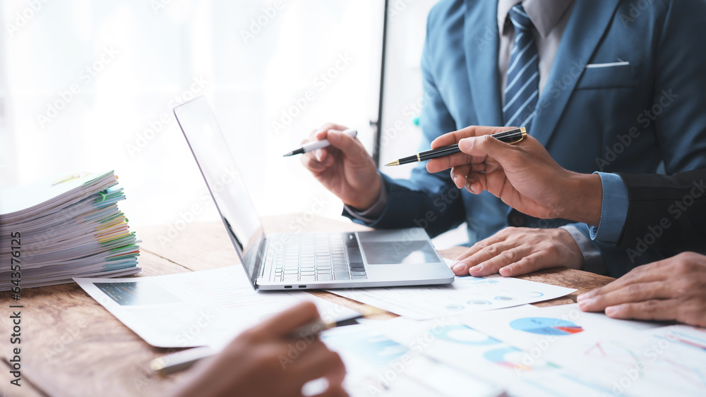 Business people meeting explaining the financial graph data and marketing plan. Business people meeting explaining the financial graph data and marketing plan.
