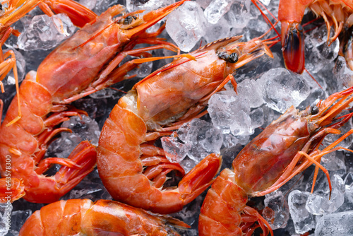 Raw shrimps on ice cubes