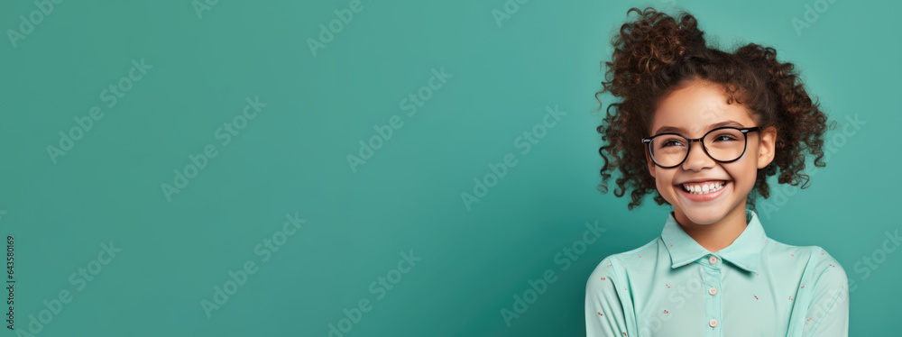 Photo of smiling middle school student with glasses on solid background. Online education concept. Copy-space, Course banner - obrazy, fototapety, plakaty 