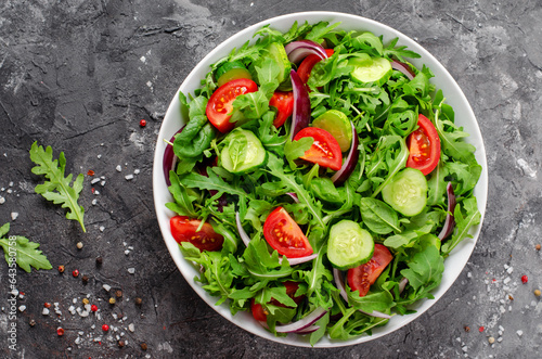 Healthy Vegetable Salad with Tomatoes, Arugula, Cucumbers and Onion, Diet Menu, Bright Background