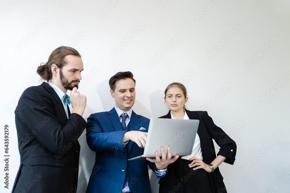 Group of business people brainstorming using laptop at table to work. Effective people in organization use idea to consult their work. Group of business people brainstorming using laptop at table to work. Effective people in organization use idea to consult their work.