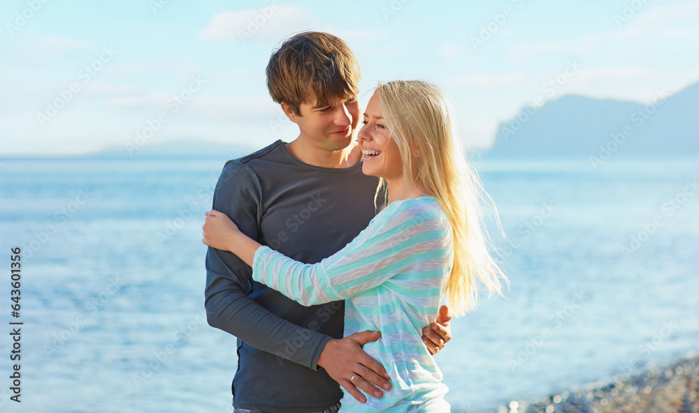 Love and romance. Honeymoon on the sea shore. Beautiful loving couple embracing on the beach Love and romance. Honeymoon on the sea shore. Beautiful loving couple embracing on the beach