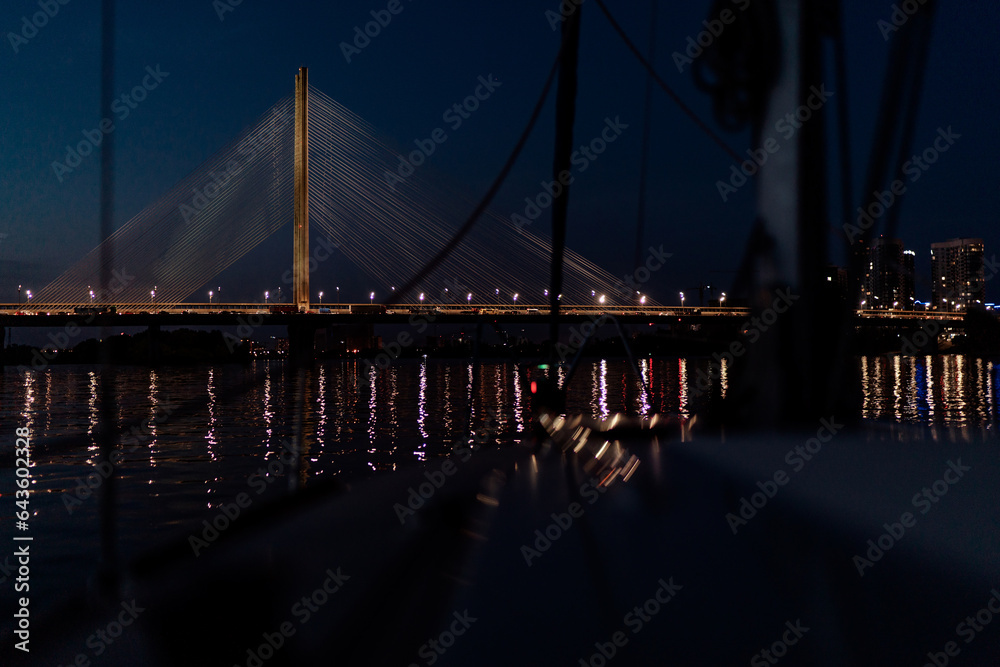 Fototapeta premium The South bridge at night, Kyiv, Ukraine. Bridge at sunset across the Dnieper River.