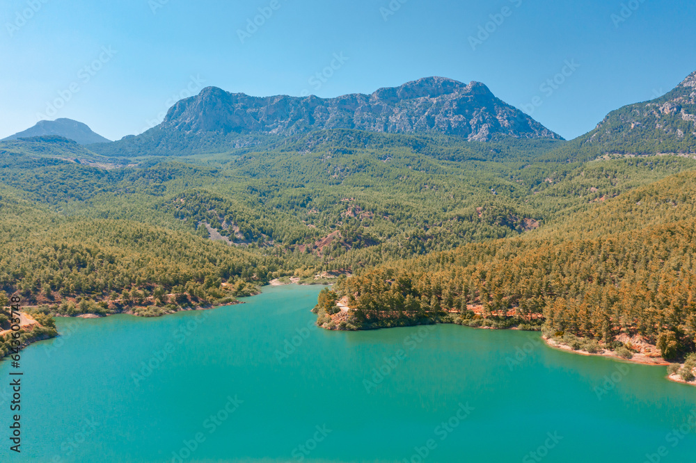 Aerial view of National Park plateau, high rock. Wooden Lake reservoir forest among rocky mountains and peaks.