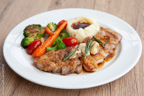 Chicken steak with mashed potatoes and grilled vegetable