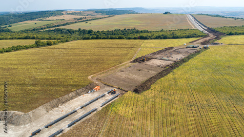 Aerial view of gas and oil pipeline construction. Pipes welded together. Big pipeline is under construction. photo