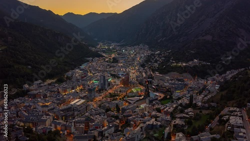Day to night aerial hyperlapse of Andorra La Vella in the middle of mountains