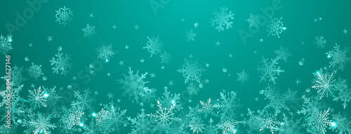 Christmas background of beautiful complex big and small snowflakes in turquoise colors. Winter illustration with falling snow