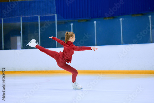 Teen girl, figure skating athlete in motion during training session on ice rink arena. Learning and growing skills. Concept of professional sport, competition, sport school, health, hobby, ad